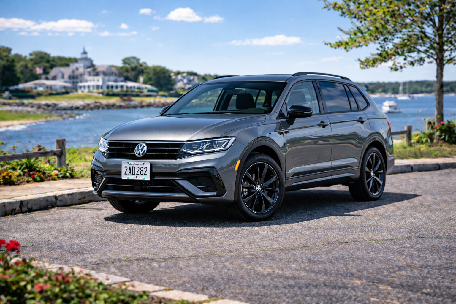 Gray Volkswagen Tiguan SUV, unit 282, viewed from the front and side